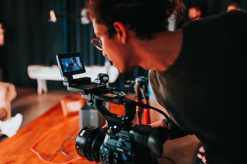 holding video camera