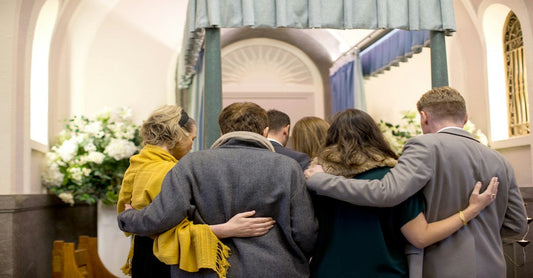 people gathered at a funeral, songs for funerals, memorial services, and celebrations of life