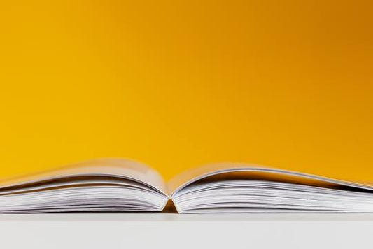 white book yellow wall