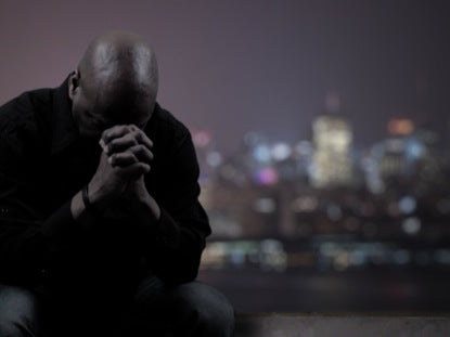 Man Praying For City