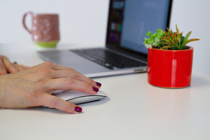 close up of hand on computer mouse